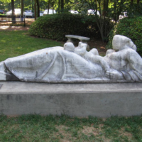 Reclining Mother and Child in front of the Roswell Library<br/> By Steffen Thomas, c. 1960 (Given in 1972) Reclining Mother and Child