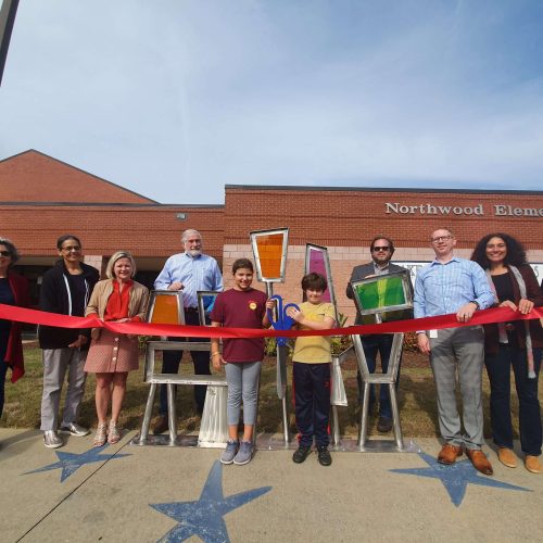 Ribbon cutting. "Unity" by Nathan Pierce. Located at Northwood Elementary.  Sponsored by Northwood Foundation.